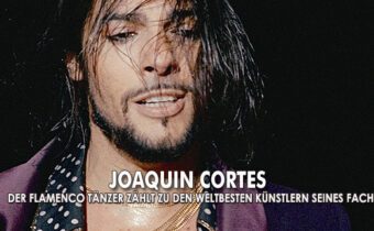Joaquin Cortes in einem lila Sakko und einem gepunkteten Hemd